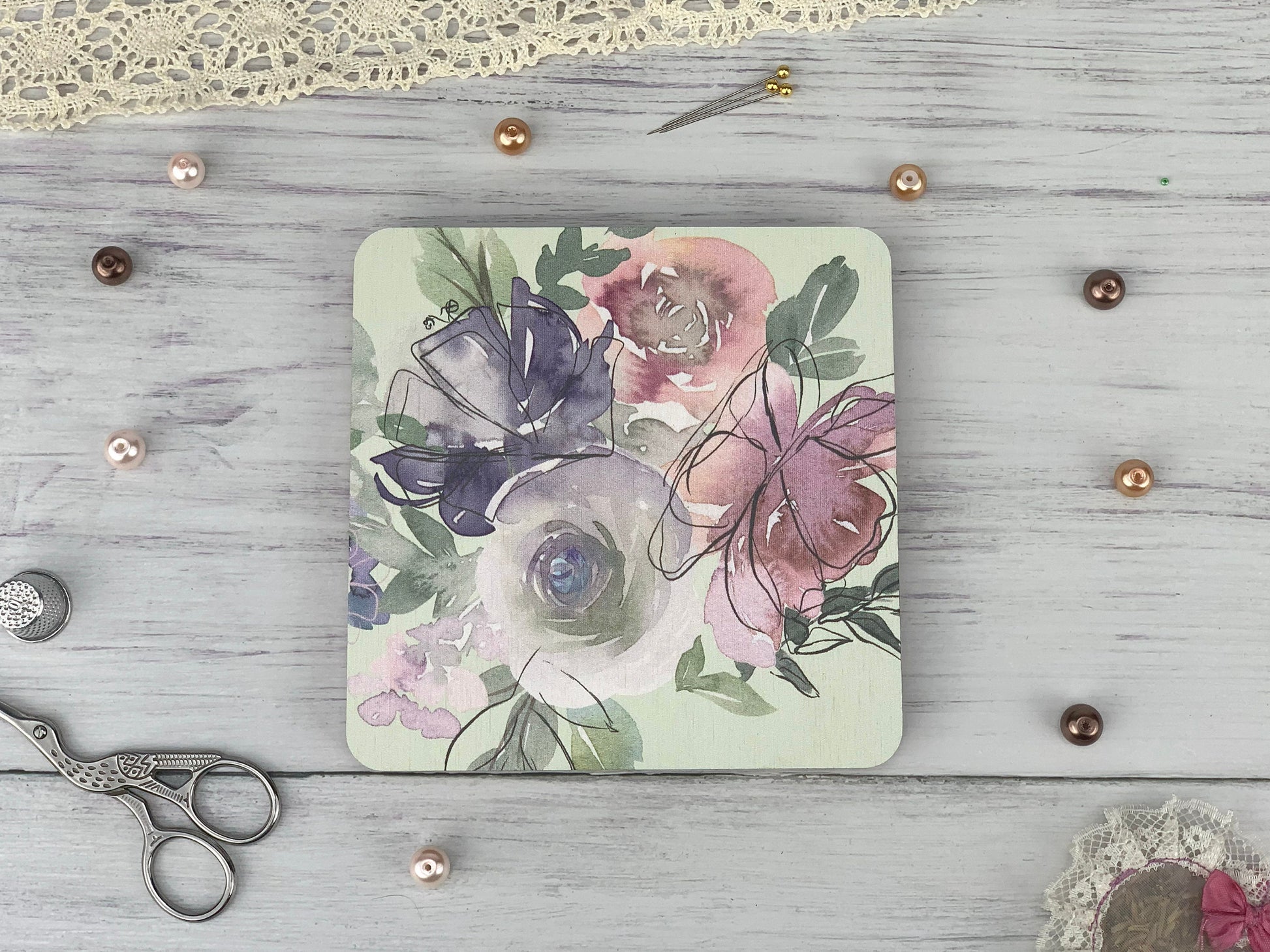 a picture of some flowers and a pair of scissors