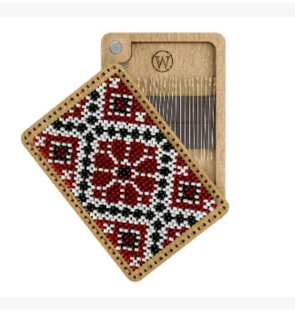 a piece of wood with a red and black design on it