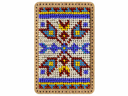 a beaded picture of a cross on a white background