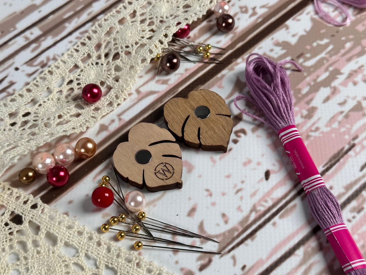 a couple of wooden hearts sitting on top of a table