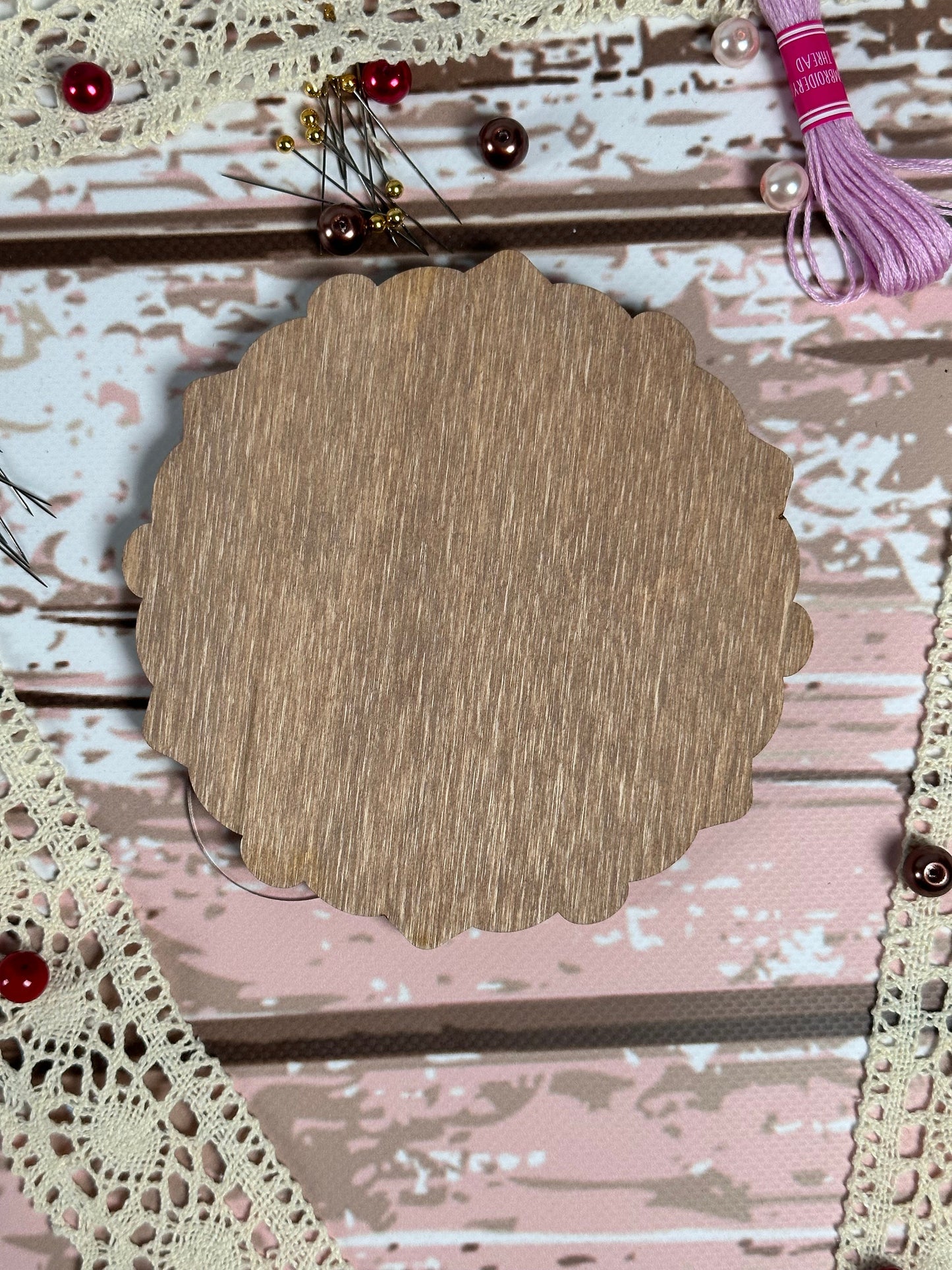 a picture of a piece of wood on a piece of lace