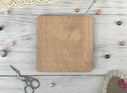 a wooden cutting board sitting on top of a table