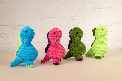 a group of crocheted toy animals sitting next to each other
