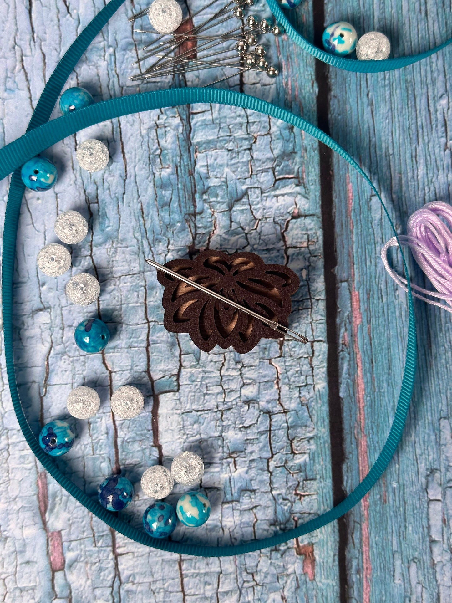 a close up of a piece of wood with beads