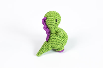 a crocheted green and purple stuffed animal