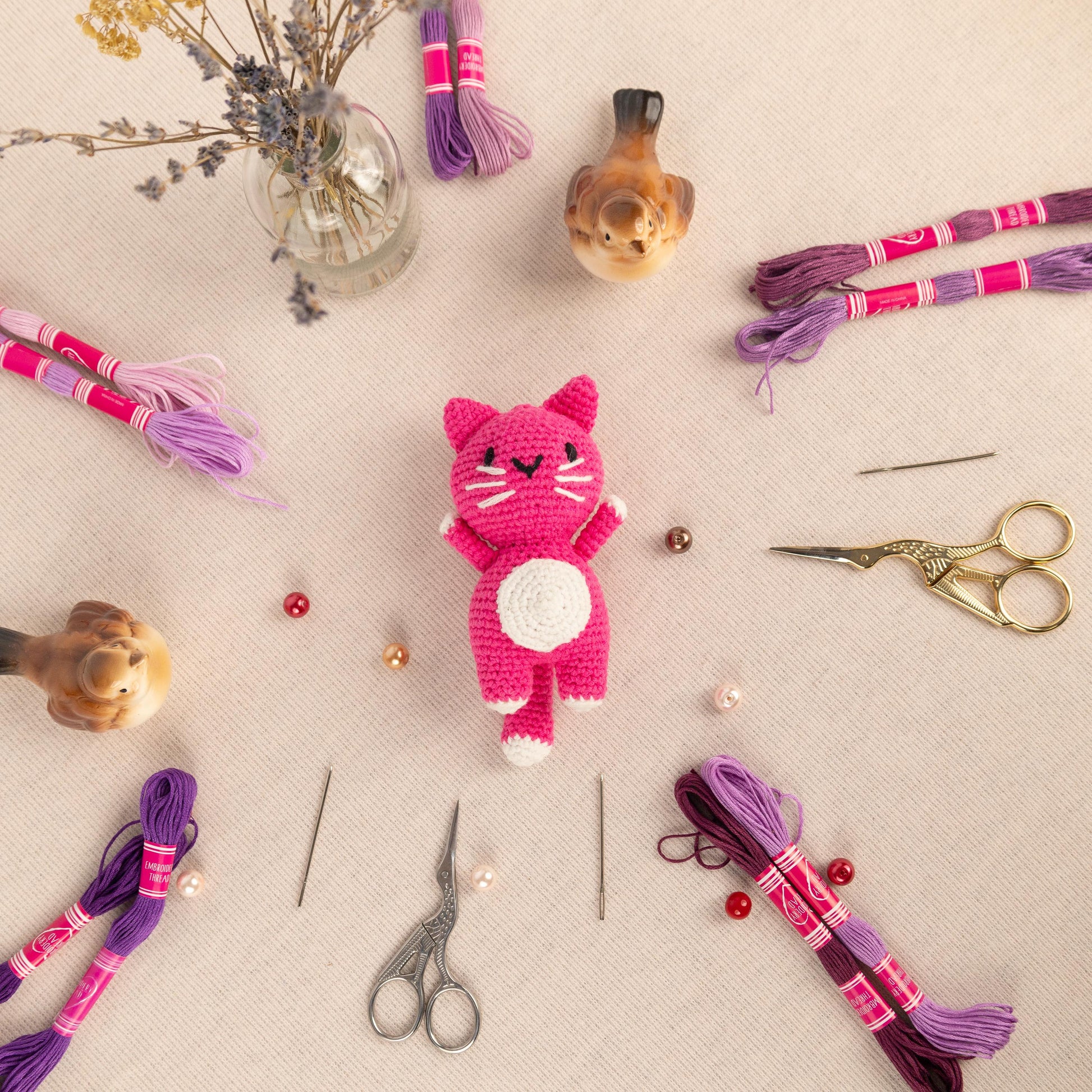 a table topped with lots of craft supplies
