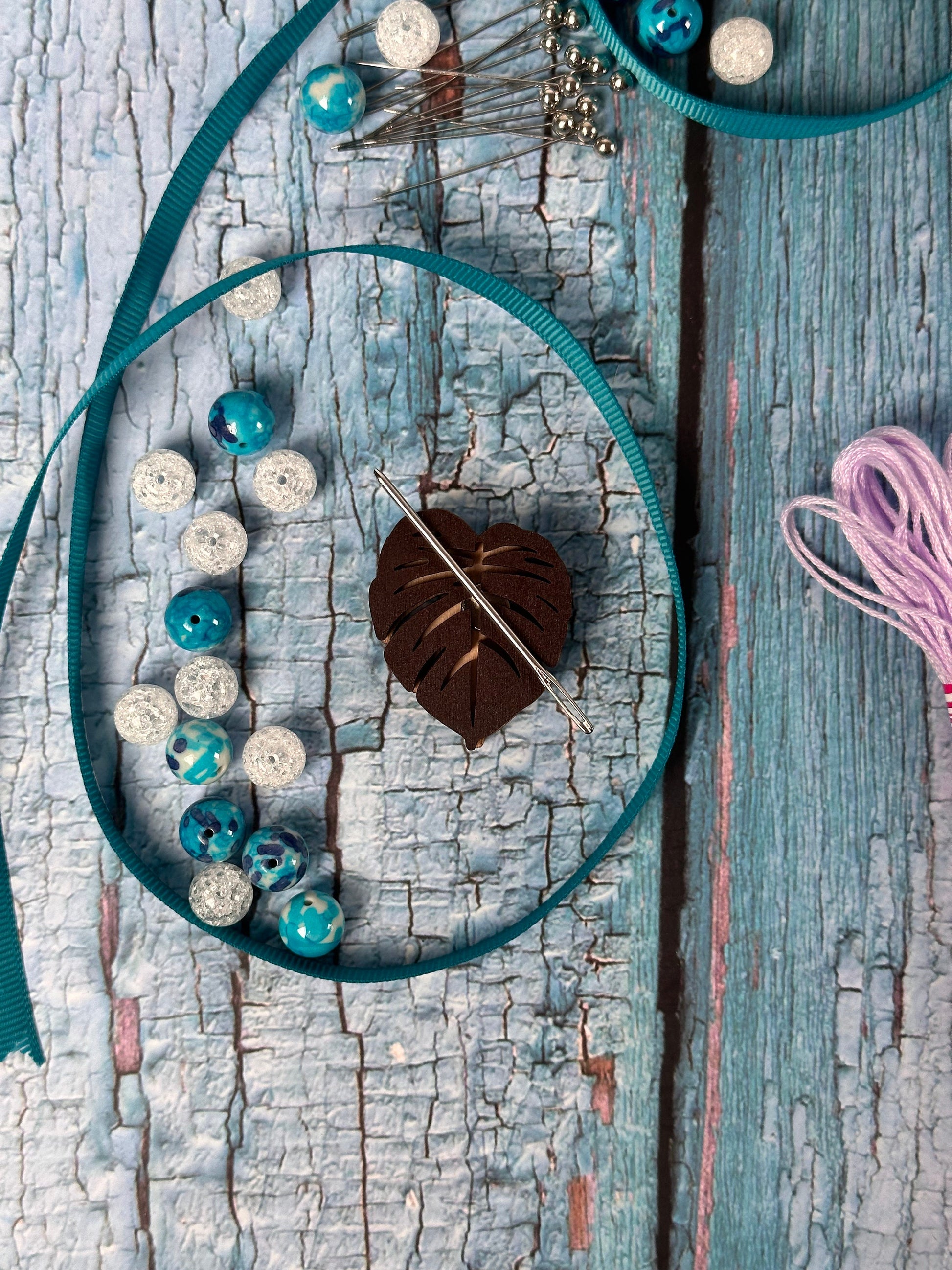 a piece of wood that has some beads on it
