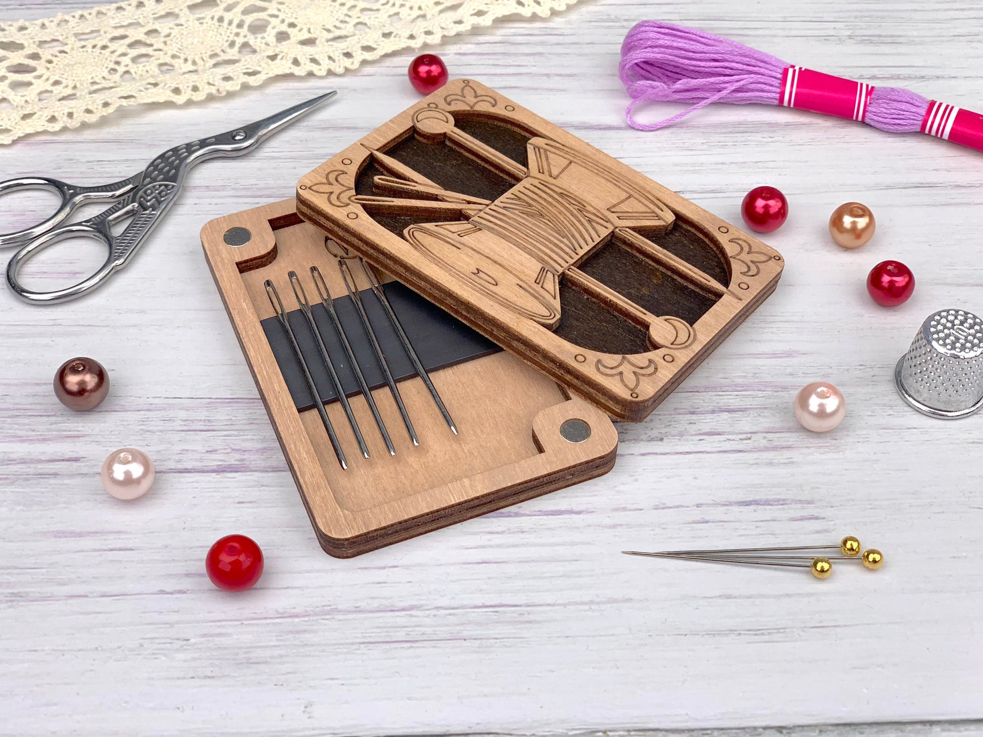 a pair of scissors, a pair of knitting needles, a pair of scissors and