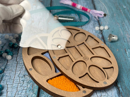 a pair of scissors sitting on top of a wooden cutting board