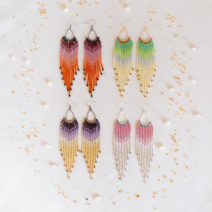 a set of four pairs of multicolored fringe earrings