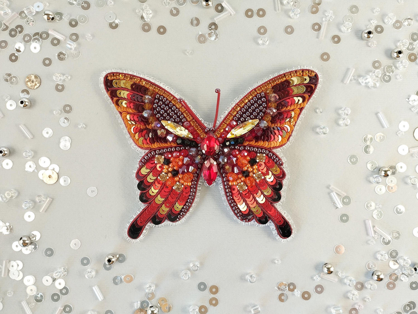 a butterfly made out of buttons on a table
