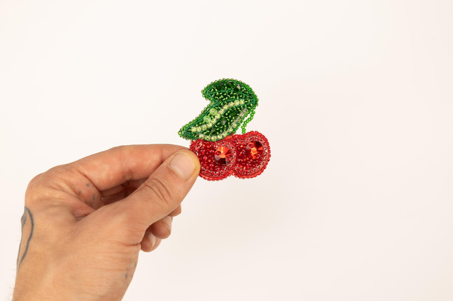 a person is holding a piece of fruit