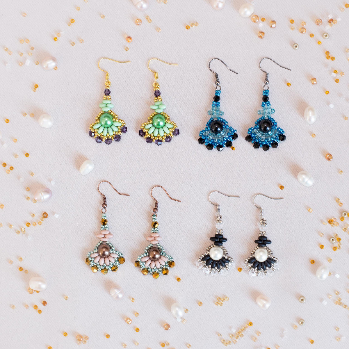 a bunch of earrings that are on a table