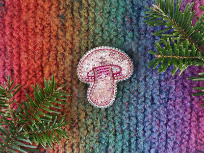 a colorful knitted blanket with a pair of flip flops on top of it