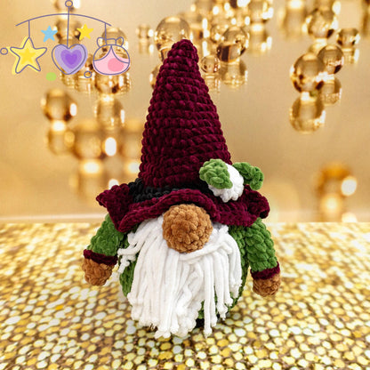 a crocheted gnome sitting on top of a table