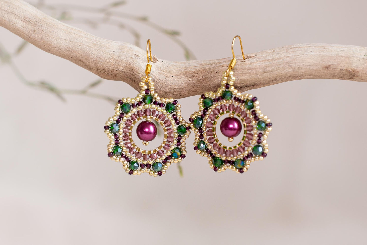 a pair of earrings on a tree branch