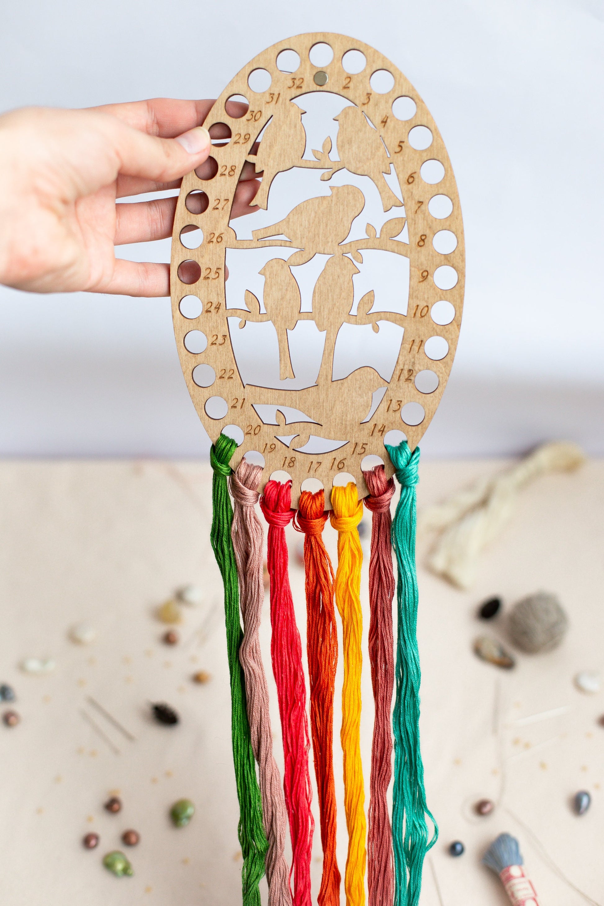 a person holding a wooden decoration with a horse on it