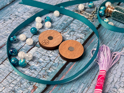a couple of wooden buttons sitting on top of a table