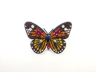 a close up of a butterfly on a white surface