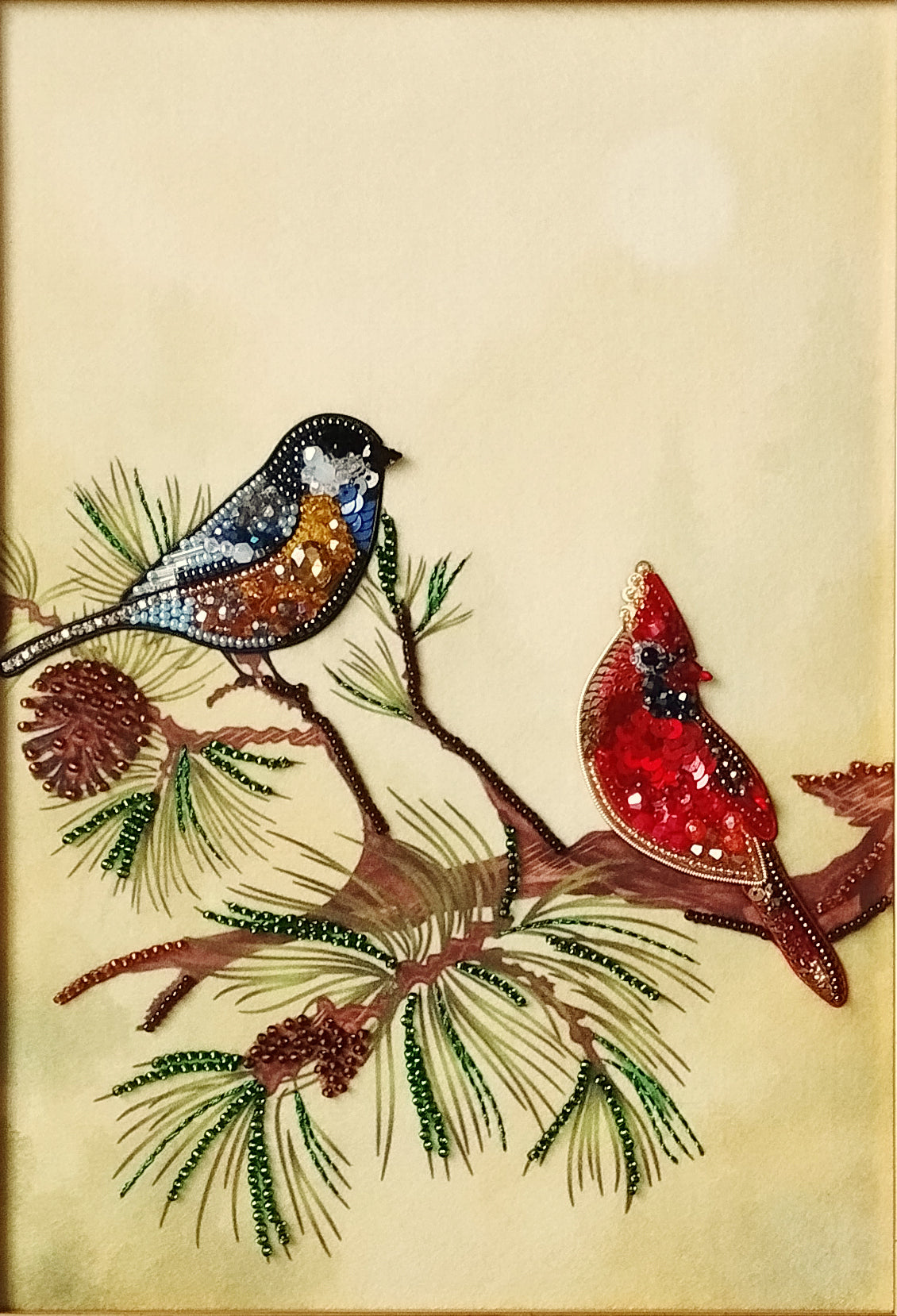 two birds perched on a branch, with one bird being a cardinal and the other a blue jay.