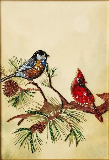 two birds perched on a branch, with one bird being a cardinal and the other a blue jay.