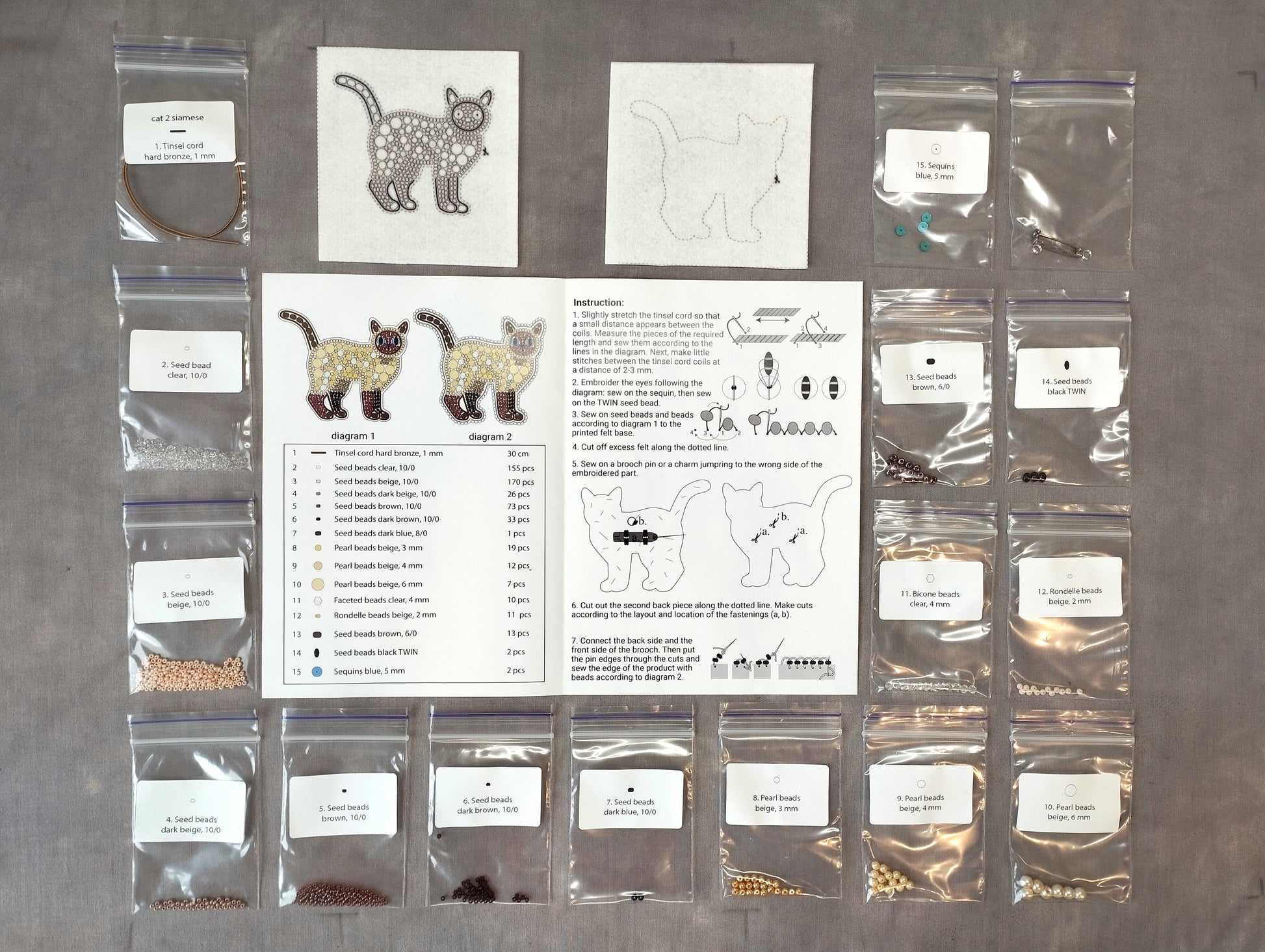 various sewing supplies and materials, including bags of beads, beads, and instructions for a sewing project.