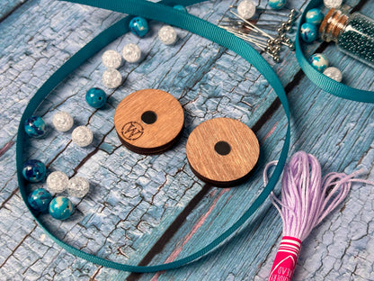 a pair of wooden buttons sitting on top of a table