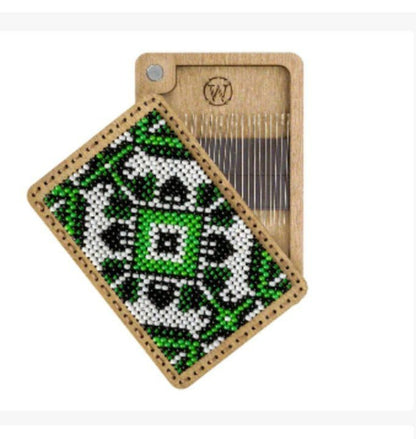 a piece of wood with a green and white design on it