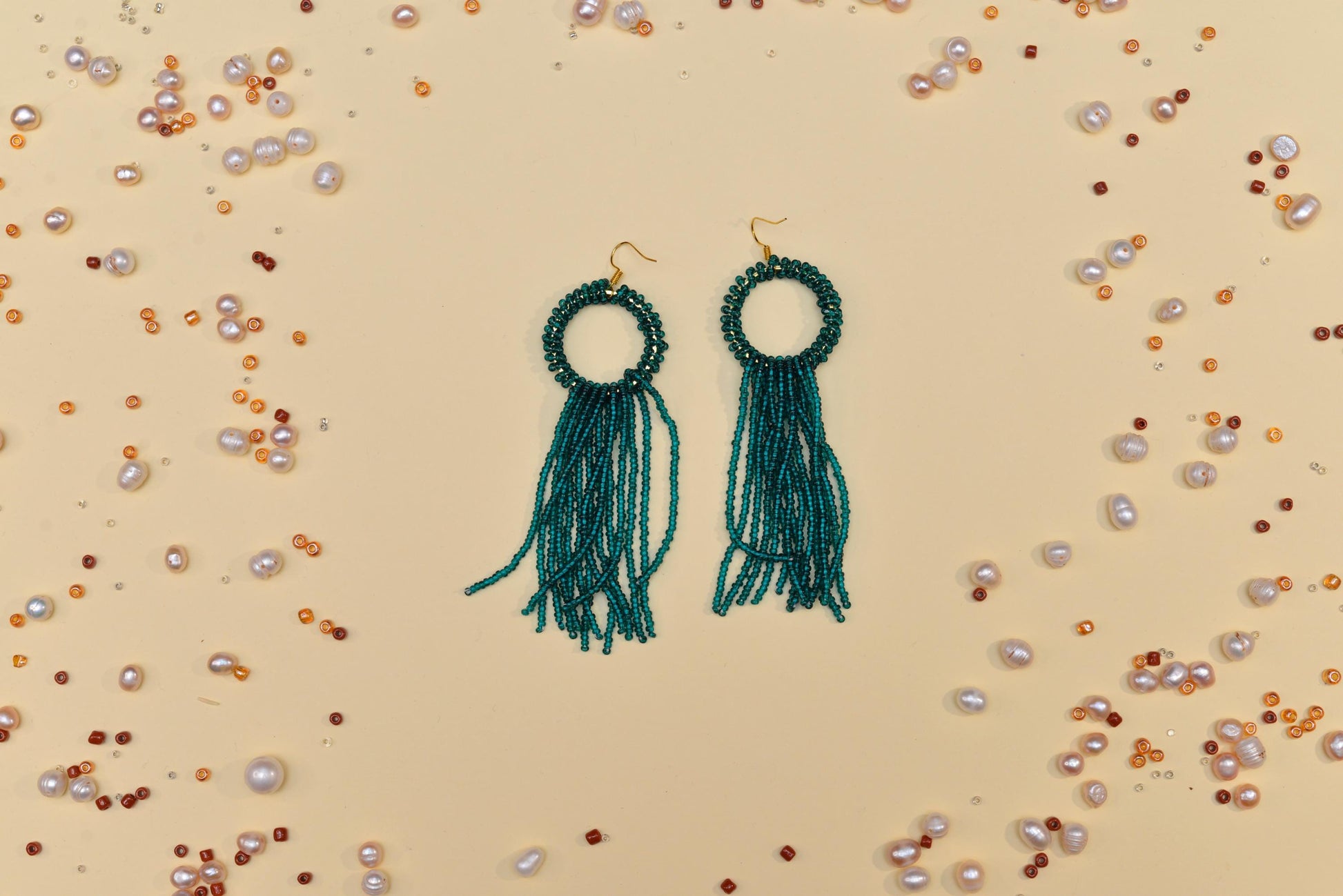 a pair of earrings sitting on top of a table