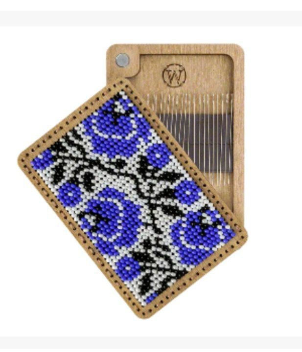 a piece of wood with a blue flower on it