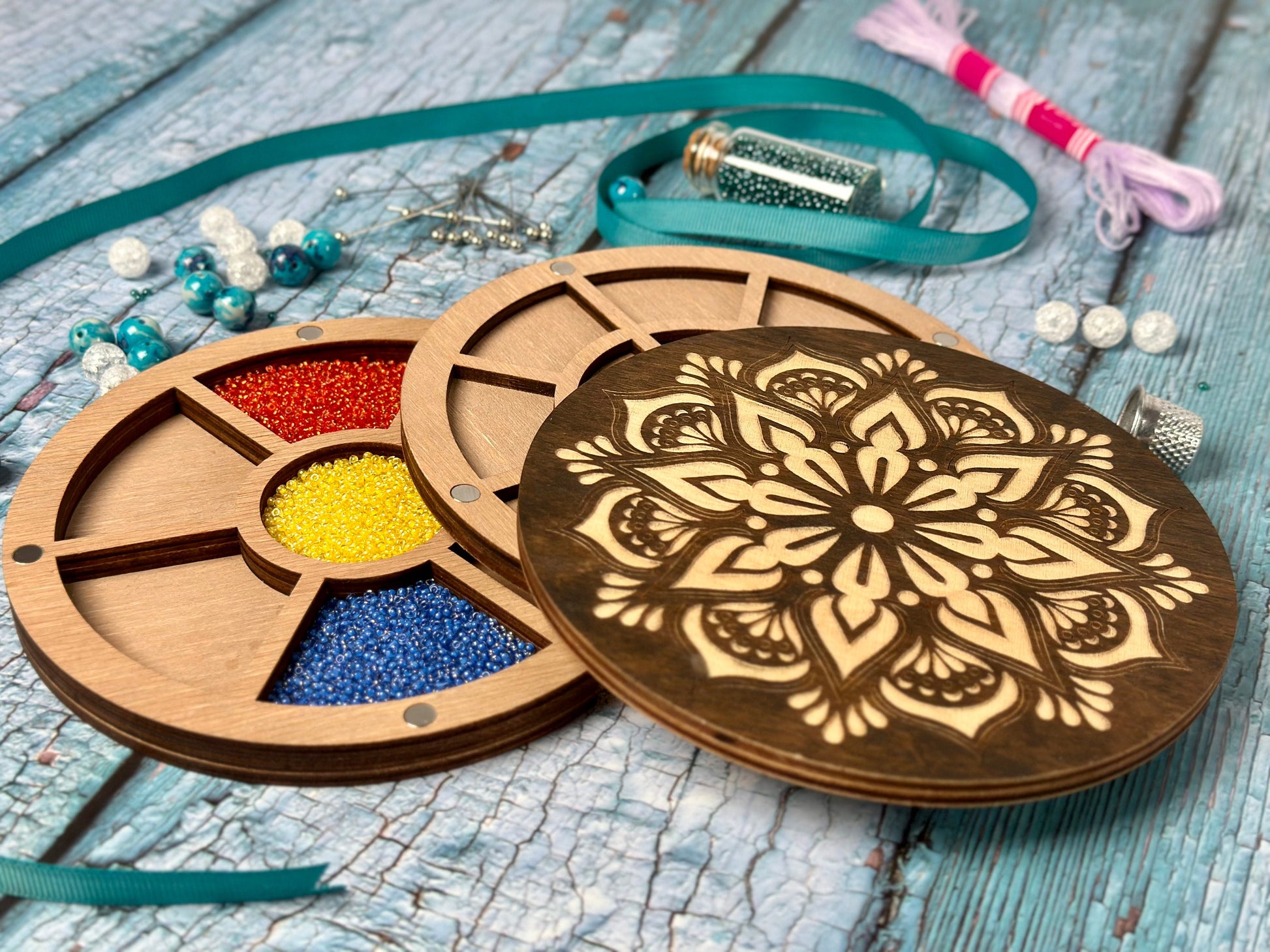 a wooden box with beads and beads in it