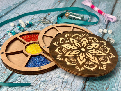 a wooden box with beads and beads in it