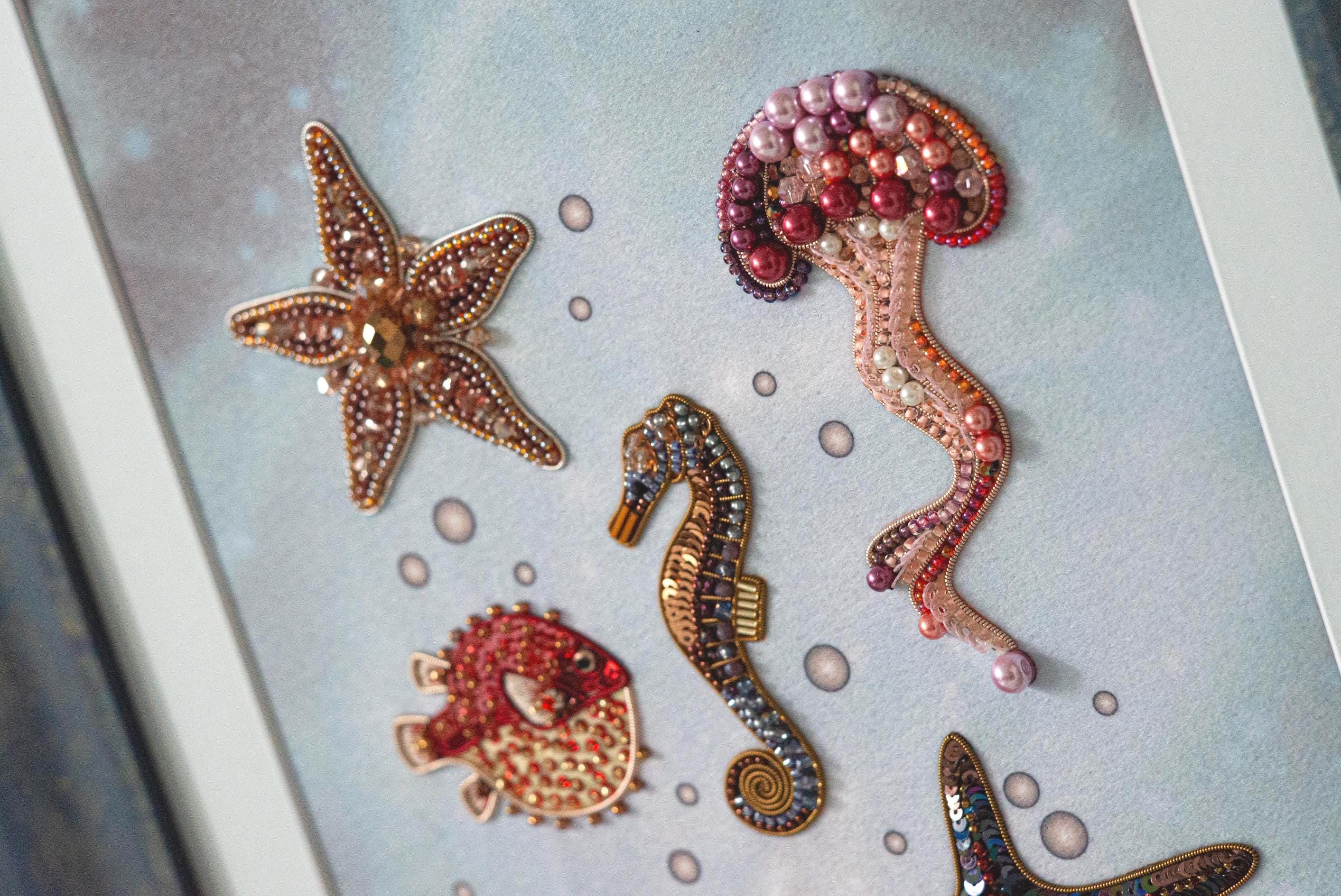 a picture of a seahorse, starfish, and seahorse broochies