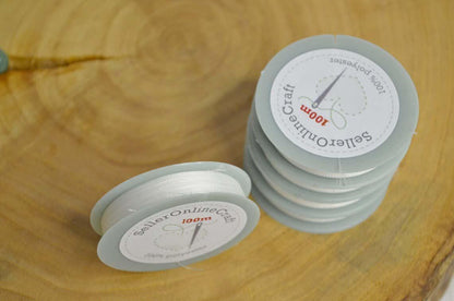 a close up of a stack of plastic cups on a wooden table