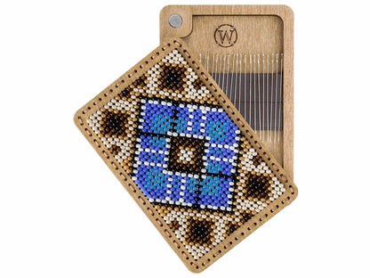 a piece of wood with a picture of a blue object on it