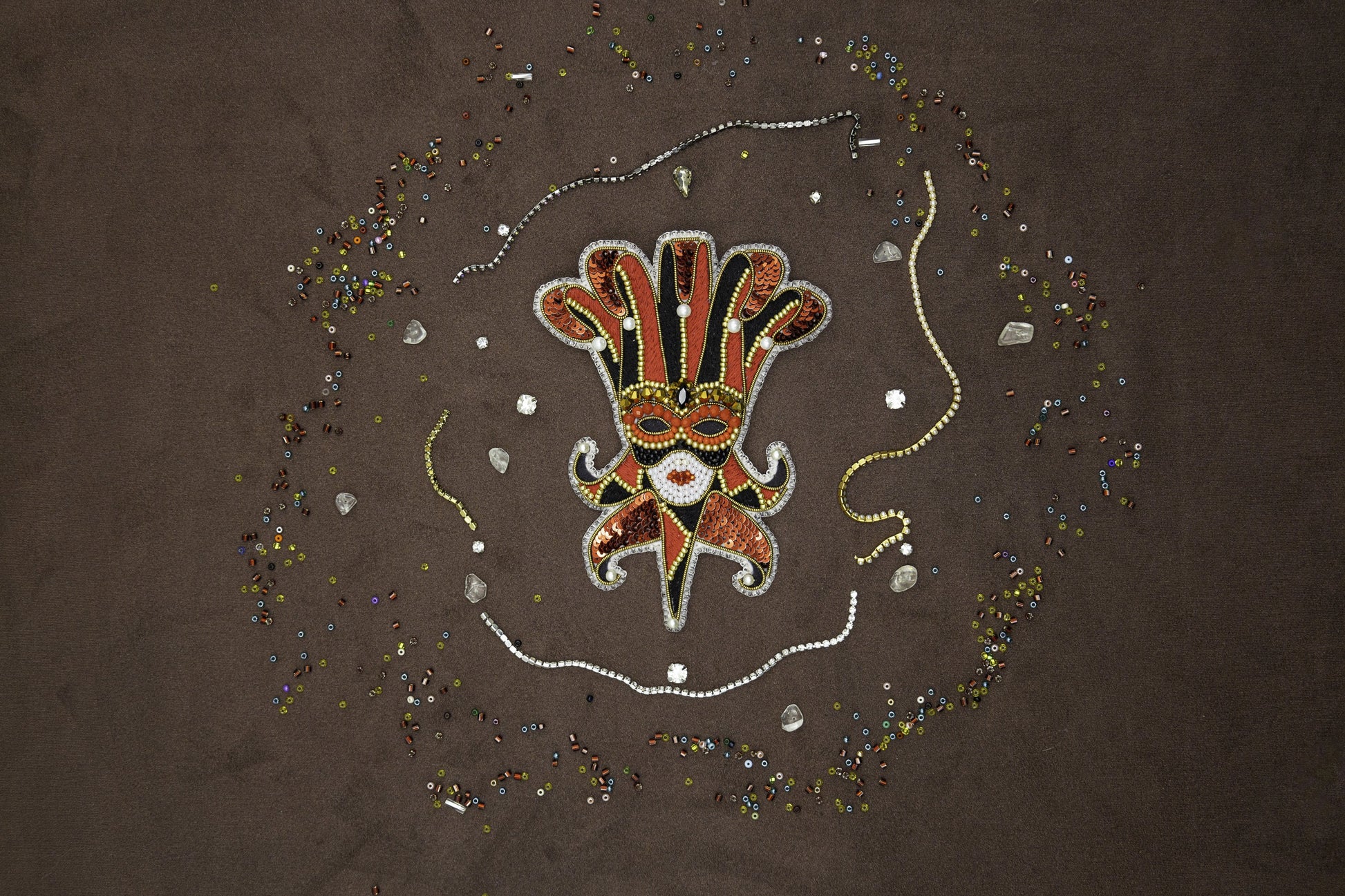 a picture of a hand with beads and beads around it