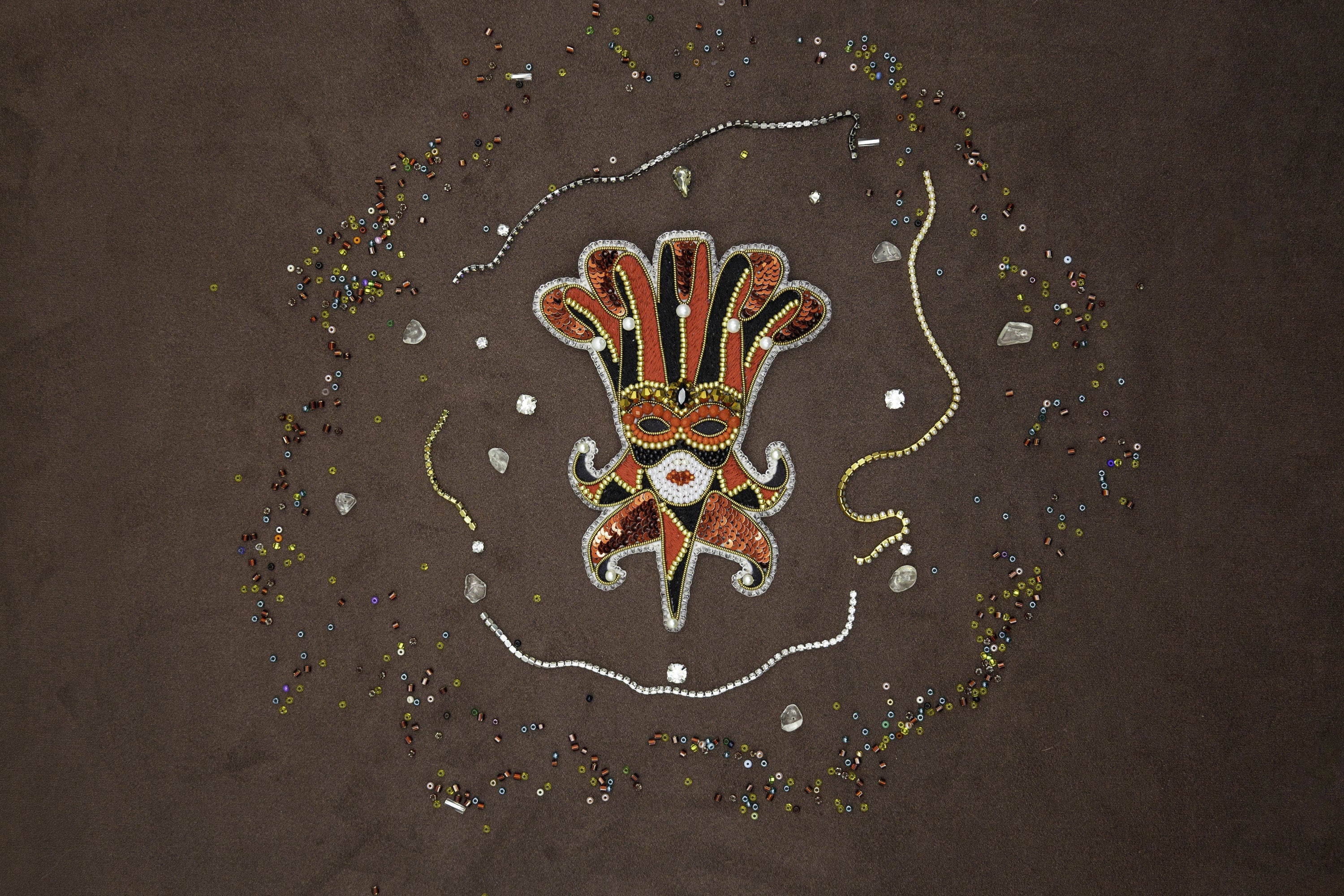 a picture of a hand with beads and beads around it