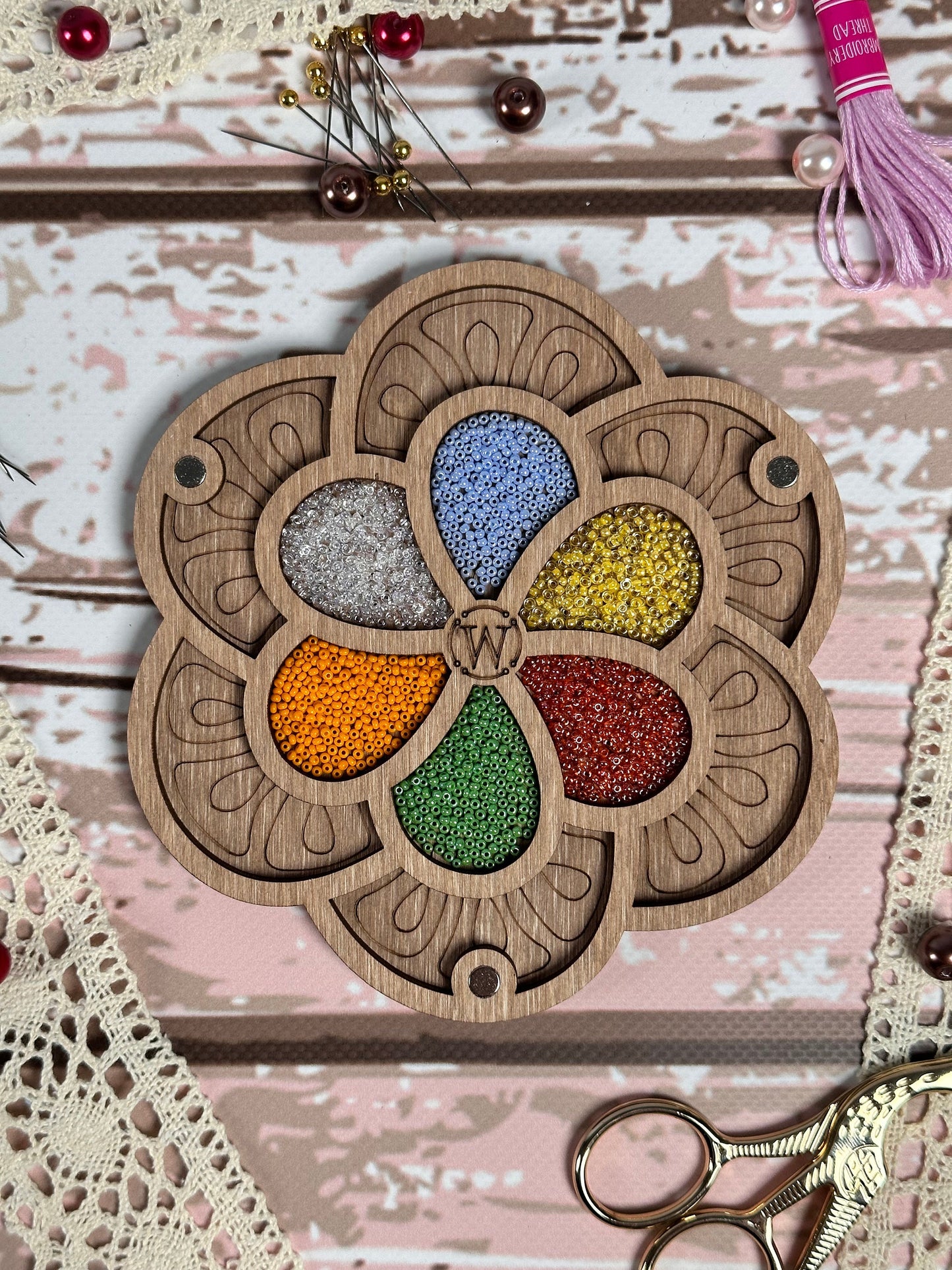 a close up of a wooden decoration with scissors