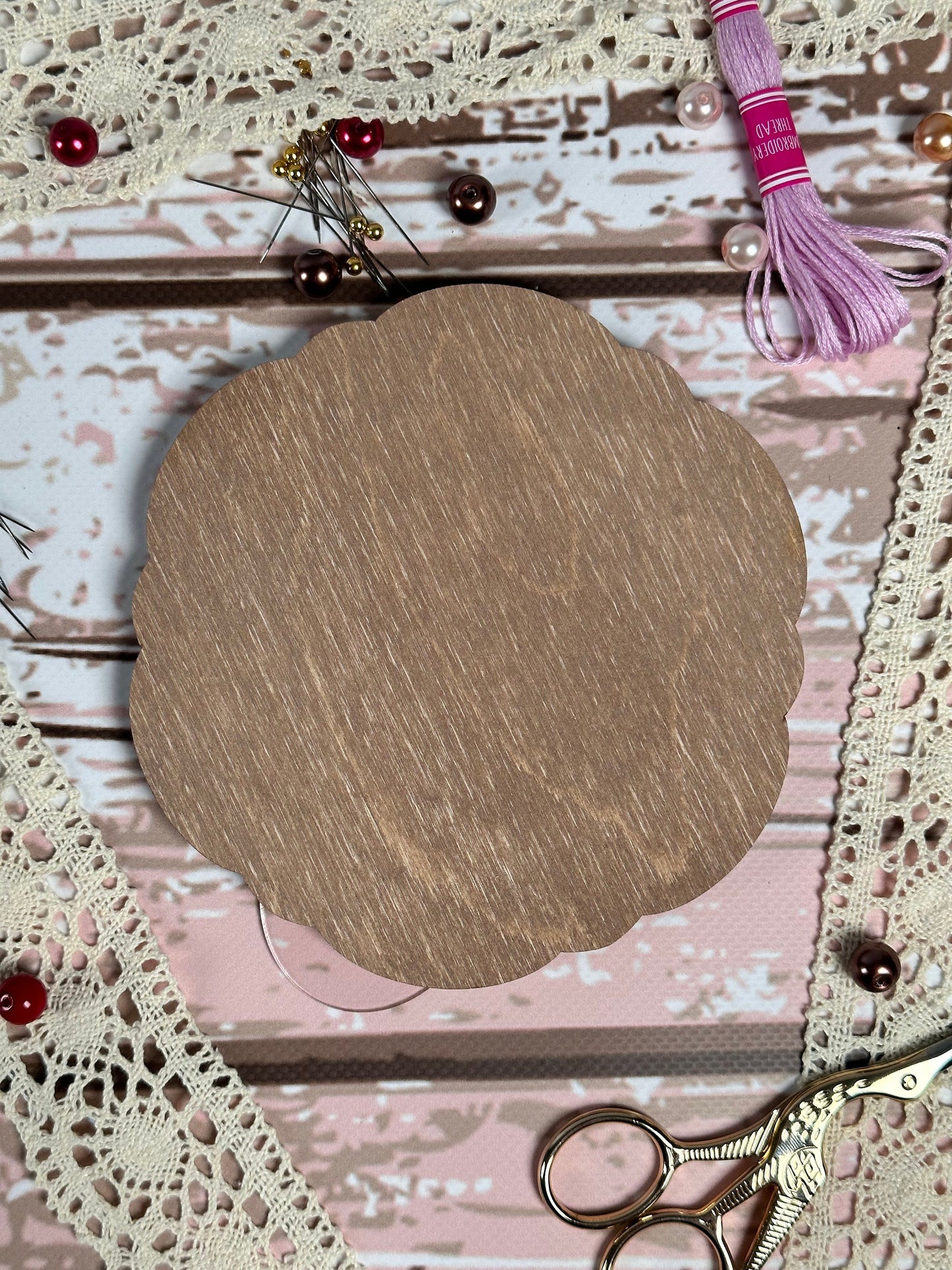 a piece of wood sitting on top of a table next to a pair of scissors