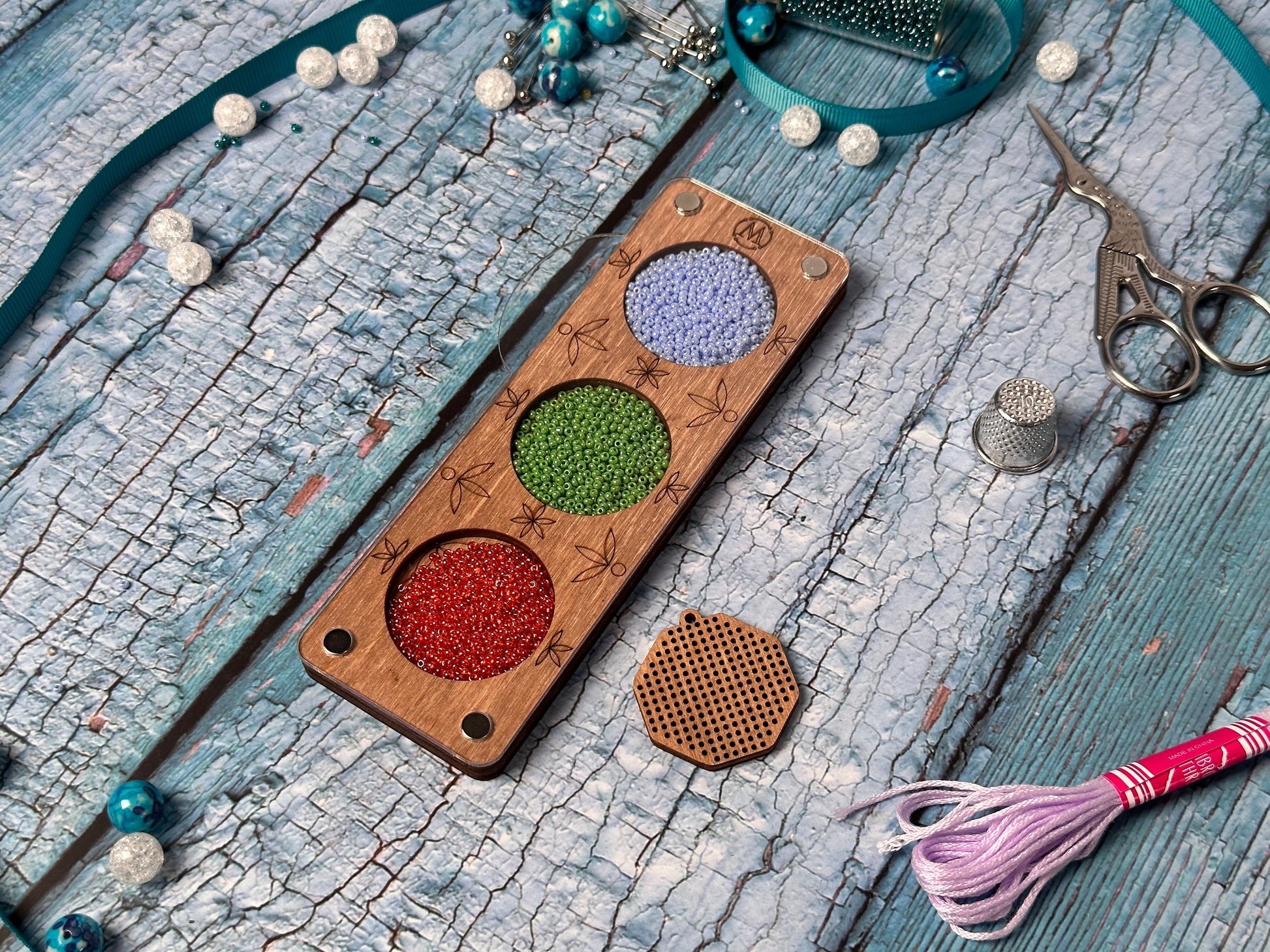 a wooden board with a bunch of beads on it