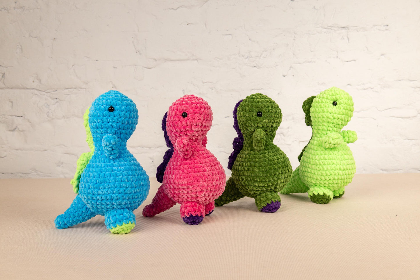 a group of small crocheted animals sitting next to each other