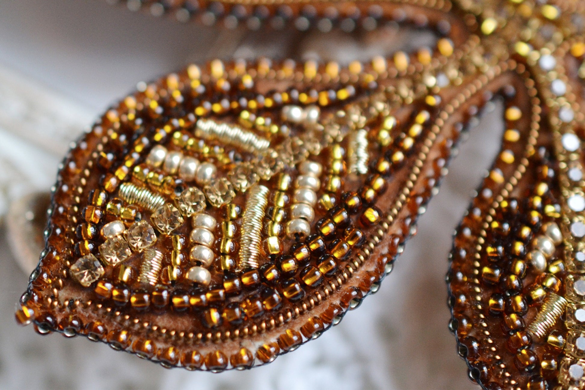 a close up of a beaded piece of cloth