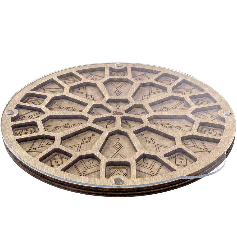 a round wooden object with a pattern on it