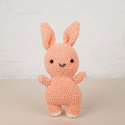 a small crocheted bunny sitting on top of a table