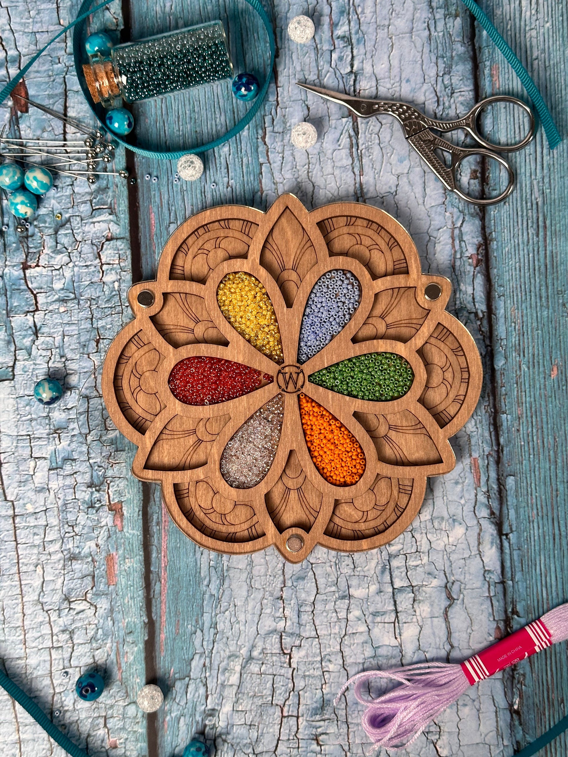 a wooden clock sitting on top of a wooden table