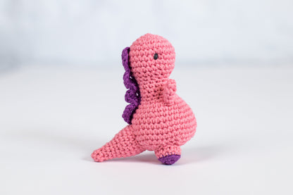 a crocheted pink and purple stuffed animal