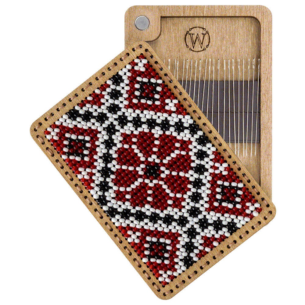 a close up of a piece of wood with a needle on it