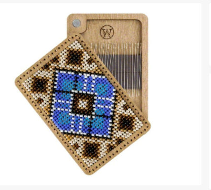 a wooden comb with a blue and black design on it