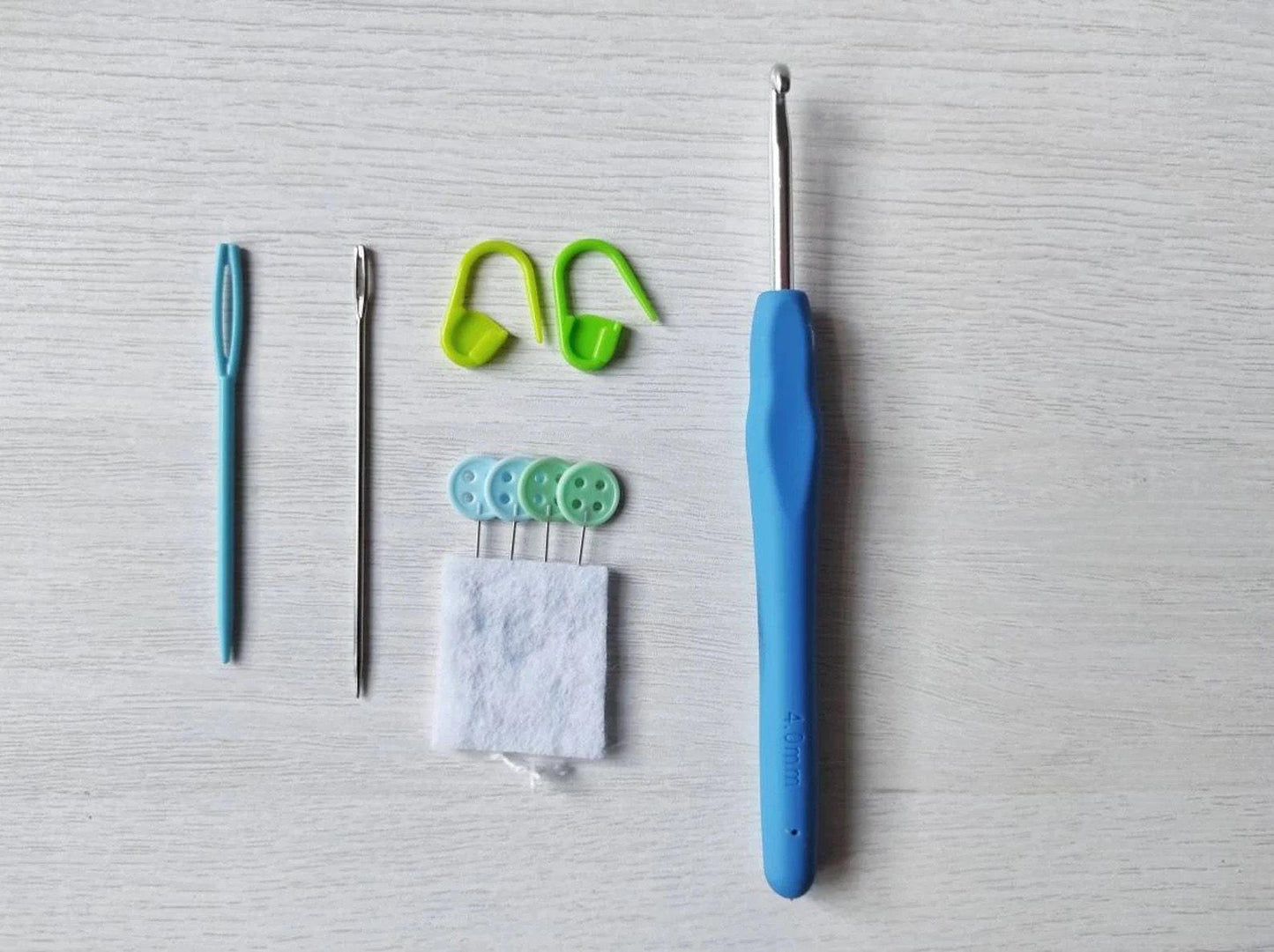 a toothbrush, a needle, a pair of scissors, and a pair of