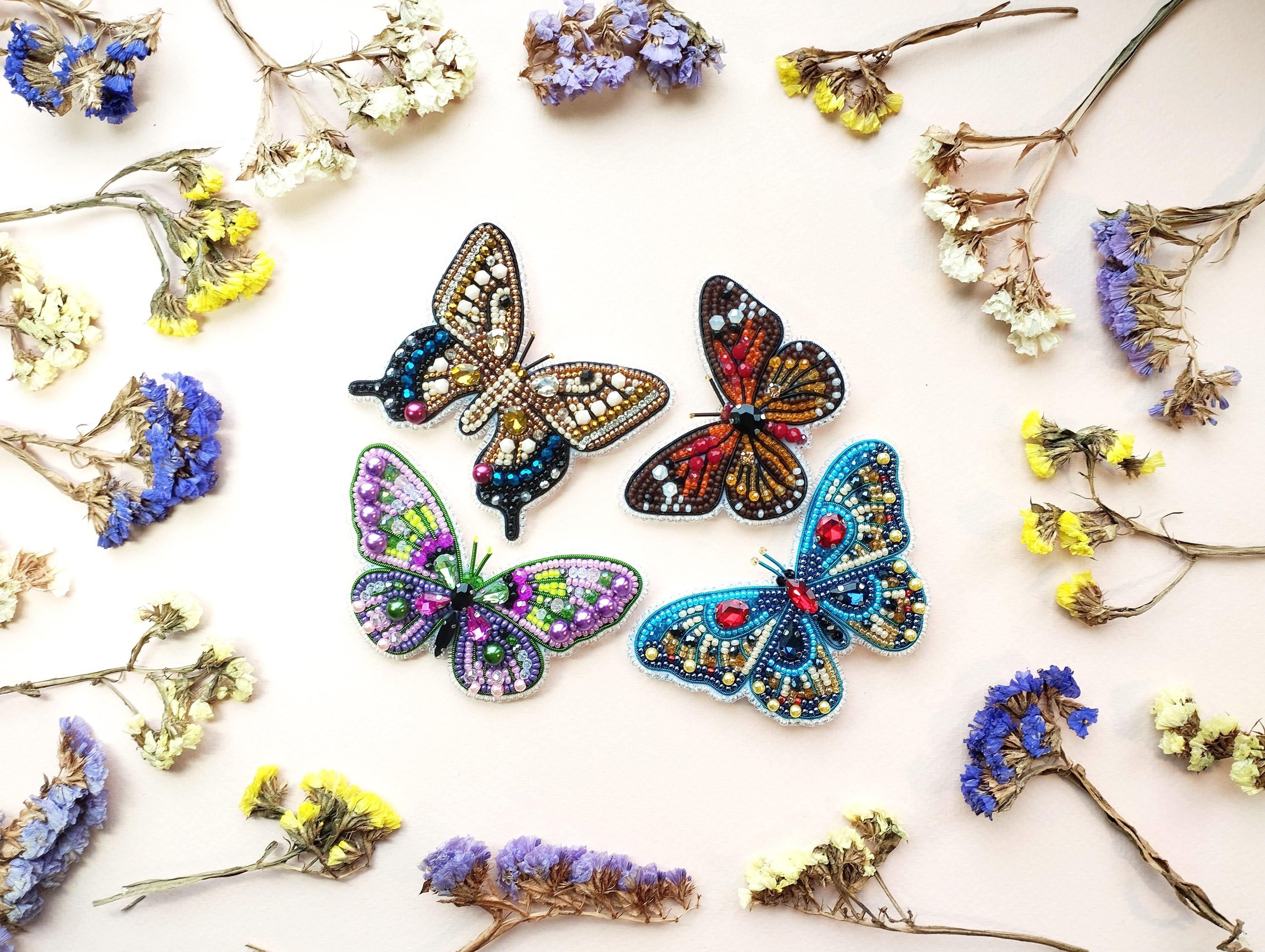 a group of butterflies sitting on top of flowers